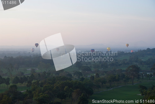 Image of Hot air balloons over a golf course