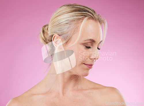 Image of Beauty, skincare and profile of mature woman with eyes closed, glowing skin and hair, natural spa makeup in studio. Mockup, advertising and luxury cosmetic, face of model isolated on pink background.