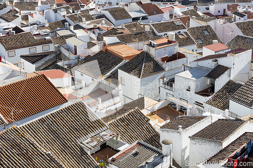 Image of Aerial panoramic view of rooftops of white houses of Olvera town, considered the gate of white towns route in the province of Cadiz, Spain
