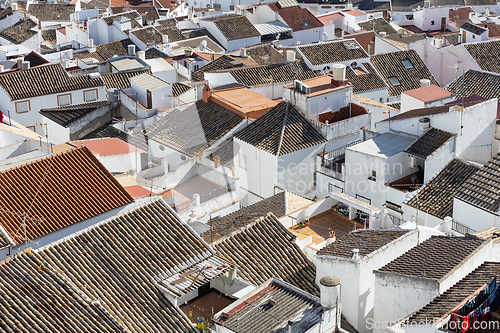 Image of Aerial panoramic view of rooftops of white houses of Olvera town, considered the gate of white towns route in the province of Cadiz, Spain