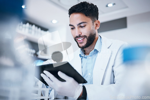 Image of Science, smile and tablet with man in laboratory for medicine, pharmacy and healthcare vaccine. Medical, internet and technology with expert reading data for experiment, investigation and cure