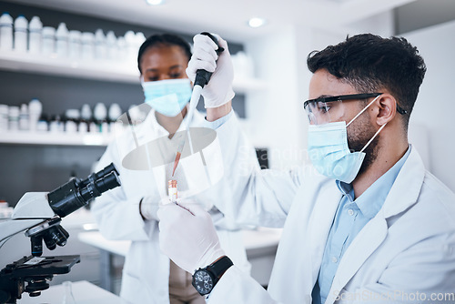 Image of Science, blood and team with vial in laboratory for scientific research, dna testing or exam. Healthcare, medicine and scientists with pipette for liquid sample, rna results and medical analytics