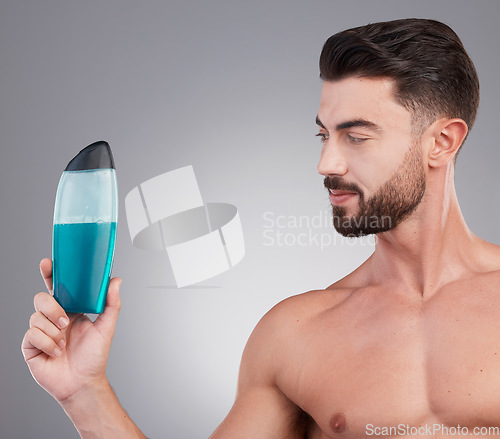 Image of Skincare, beauty and shower gel with man and product with mockup for spa treatment, wellness and hygiene. Fresh, cosmetics and hydration with model holding bottle for health, grooming and cleaning