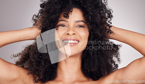 Image of Skincare, happy or portrait of black woman in studio with natural hair, cosmetic and face routine. Health smile, beauty or girl model from Puerto Rico for facial wellness isolated by gray background