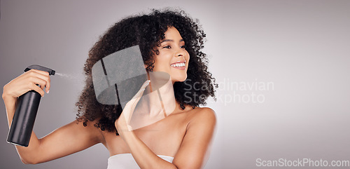 Image of Hair, spray and black woman with product for natural wellness, growth and shine on gray background. Beauty face, salon copy space and happy girl smile with hairspray, cosmetics and keratin treatment