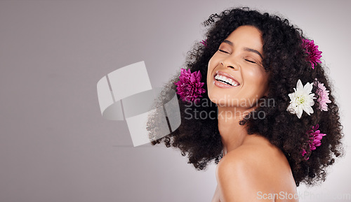 Image of Black woman, beauty and smile with flower hair in cosmetics or skincare against a gray studio background. Happy African American female model smiling in joyful satisfaction for floral art on mockup