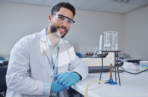 Image of Man, portrait and laboratory glass in science research, future dna engineering or innovation analytics on fire. Happy, smile and scientist beaker in healthcare pharmacy test and medical study safety