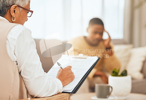 Image of Man on sofa, therapist writing notes on clipboard for mental health advice and consulting in office. Stress, anxiety and depression, sad person and psychologist in consultation room with patient.