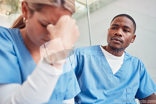 Image of Healthcare, collaboration or loss and a sad nurse in the hospital with a man colleague showing compassion. Medical, death and insurance with a black male medicine professional consoling a friend