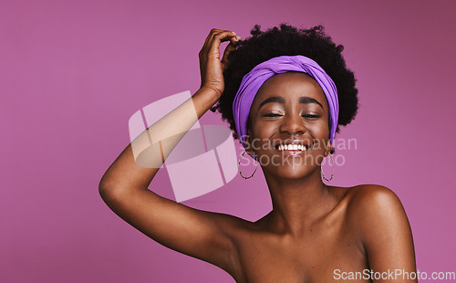 Image of Portrait, beauty and mockup with a model black woman on a purple background in studio for natural skincare. Face, hair and headband with a young afro female posing to promote cosmetic treatment