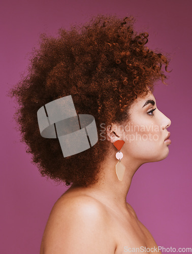 Image of Woman, profile or afro hairstyle on isolated purple background in empowerment, curly maintenance or skincare salon promotion. Beauty model, natural or hair growth texture on cosmetics studio backdrop