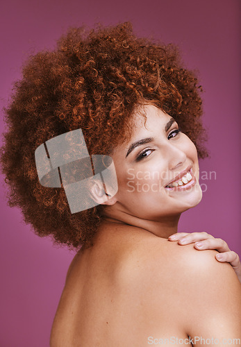 Image of Happy woman, shoulder and afro hairstyle portrait in empowerment, curly maintenance or skincare salon. Smile, beauty model or natural hair texture on cosmetics studio or on isolated purple background