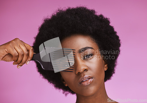 Image of Portrait, hair or afro brush on beauty background in relax grooming routine, texture maintenance or growth wellness. Black woman, face or natural hairstyle comb with skincare makeup on isolated pink