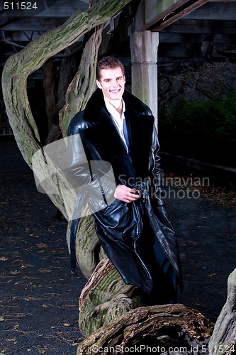 Image of Handsome man with tree