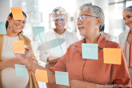 Image of Senior, business meeting or CEO writing a marketing strategy, advertising plan or branding ideas. Sticky notes, pregnant woman or manager planning a global startup project with creative employees