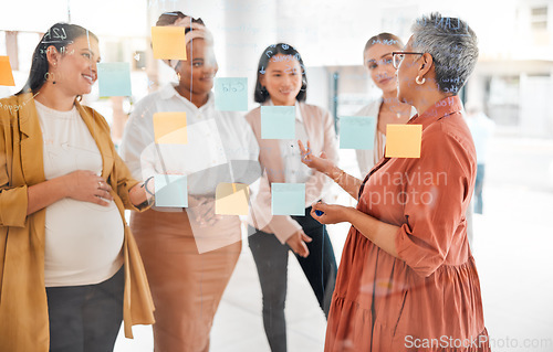 Image of Senior woman in a business meeting for marketing strategy, advertising plan or branding ideas. Sticky notes, leadership or mature manager planning a global startup project with creative employees