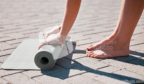 Image of Stretching, roll and feet of woman with yoga mat for pilates, mediation and workout training. Zen, health and motivation with hands of girl on ground ready for mindfulness, relax and wellness