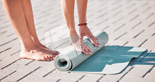 Image of Pilates, roll and feet of women with yoga mat for fitness, mediation and workout training. Zen, health and start with hands of girl stretching on ground ready for mindfulness, relax and wellness