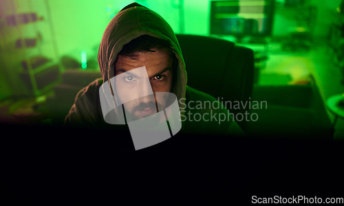 Image of Computer hacker, night and neon man hacking online database software, website server or password phishing. Ransomware developer, cyber security programming and green programmer coding malware code