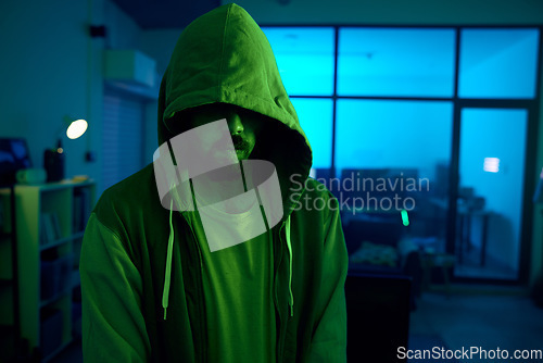 Image of Man, hacking or dark hoodie in neon living room with cybersecurity, software programming or phishing mystery. Hacker, hood or night clothes with secret virus ideas of fraud scam, crime or theft
