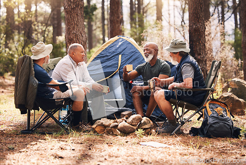 Image of Man, friends and camping in nature with coffee for travel, adventure or summer vacation together on chairs by tent in forest. Group of men relaxing, talking or enjoying natural camp by trees outdoors