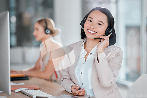 Image of Asian woman, call center and portrait smile for telemarketing, customer support or service at office desk. Happy female consultant or agent smiling in contact us for desktop advice, help or sales