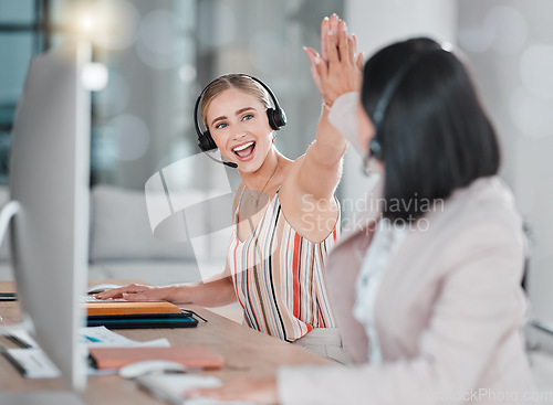 Image of Woman, call center and high five for team telemarketing, winning or promotion in customer support or service at office. Happy female consultants celebrating sale, deal or achievement in contact us