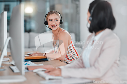 Image of Telemarketing, teamwork and women talking in call center, office or company workplace. Customer service, collaboration and happy female sales agents, consultants or friends in communication or chat.