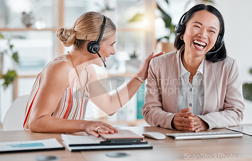 Image of Office, women in call center laughing together at joke with happy face and smile at desk, fun while working in crm. Telemarketing, happiness and employees support, motivation and trust with headset.