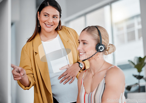 Image of Telemarketing, manager help consultant and call center with coworker explains new system, process and support. Women, female agent and supervisor in office, conversation and coaching in workplace