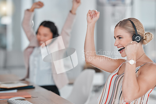 Image of Woman, call center and team celebration for winning, promotion or sales bonus in telemarketing at the office. Happy female consultants celebrating victory, deal or teamwork success in contact us