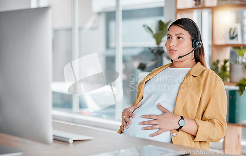 Image of Office, pregnancy and woman doing breathing exercise and hands on stomach in call center with headset. Burnout, pain and pregnant telemarketing consultant holding belly while working on computer.