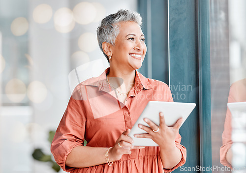 Image of Tablet, thinking and senior business woman in office contemplating, research or internet browsing. Technology, ideas or happy elderly female with touchscreen by window for networking or web scrolling