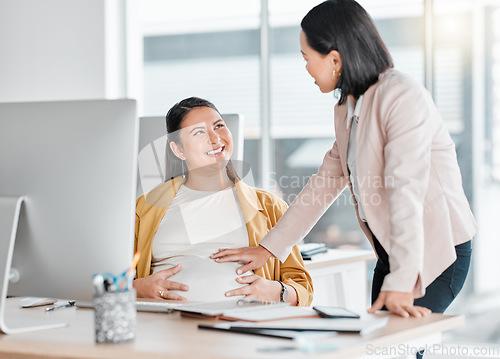 Image of Pregnancy, friends touch and office workplace by computer with colleague, smile and talking with future mom. Pregnant woman, desk and happy chat for support in career for women, abdomen and desktop