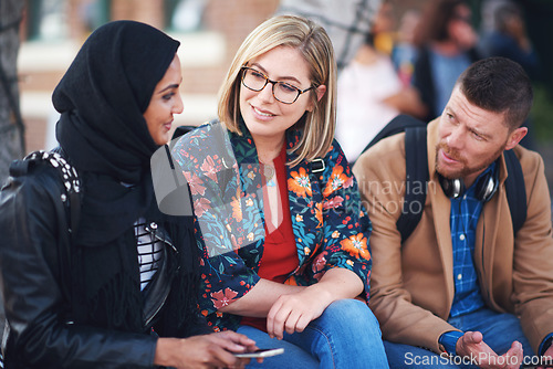 Image of Friends, diversity and happy people with communication and connection outdoor on stairs. Hijab, muslim and talking women and adult learning and international student community on college steps