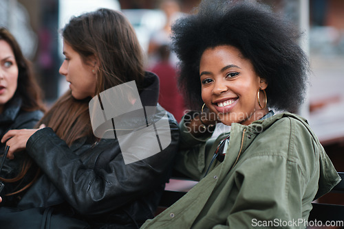 Image of Black woman, portrait and friends outdoor with communication on a urban bench. Happiness, women group and conversation of a young person with a happy smile feeling relax with blurred background