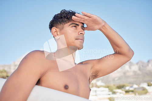 Image of Surfer man, looking and beach in summer for waves, exercise and vision for fitness, training or goals. Young gen z, athlete and outdoor adventure with surfboard, ideas and workout by ocean for health