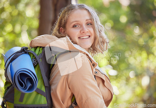 Image of Woman, hiking portrait and forrest with smile for freedom, peace and outdoor adventure for exercise. Gen z explorer girl, face and happiness for fitness, wellness and mindset in woods on summer walk
