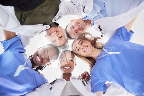 Image of Happy teamwork, diversity and doctors in huddle of support, help or medical collaboration. Portrait group of healthcare workers in circle with heads together, smile face and happy hospital management