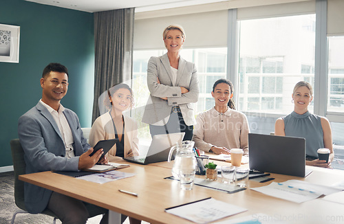 Image of Portrait of employees at desk in office with smile, confidence and meeting for group of business people. Teamwork, about us and leadership, senior lawyer with happy legal team at advisory law firm.