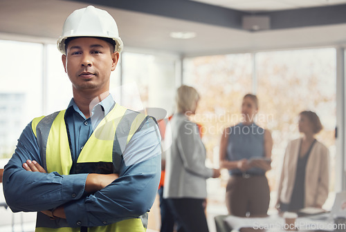 Image of Portrait, construction worker and building with a man engineer standing arms folded in an architecture office. Industrial, mananger and leadership with a male architect working on a design project