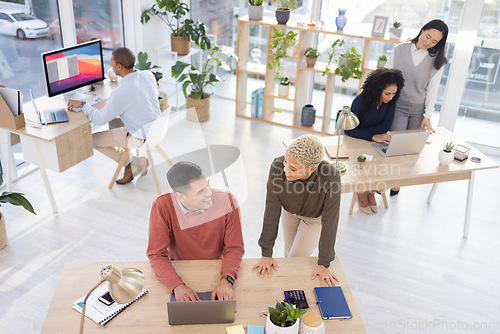 Image of Leadership, black woman or manager coaching a worker in startup or group project in a digital agency. Team work, laptop or employee helping, talking or speaking of our vision or branding direction