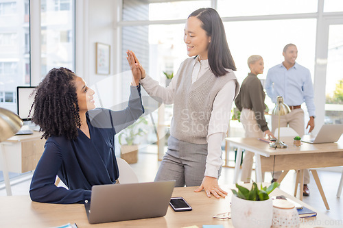 Image of Business women, high five and corporate team celebrate success, win or target achievement in office. Diversity people or employee and mentor or manager with hands for goal, teamwork and collaboration