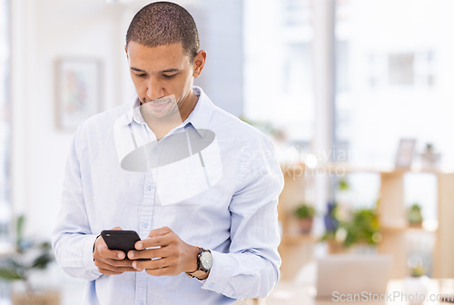 Image of Phone, office and businessman browsing on the internet, social media or mobile app for research. Technology, professional and male corporate employee reading information on cellphone in the workplace