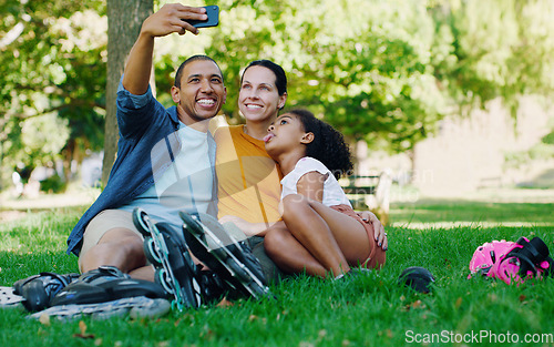 Image of Interracial family selfie, girl and park with rollerblades, bonding or smile for profile picture, happy or holiday. Black man, mom and child for happiness, hug or diversity for social media on grass