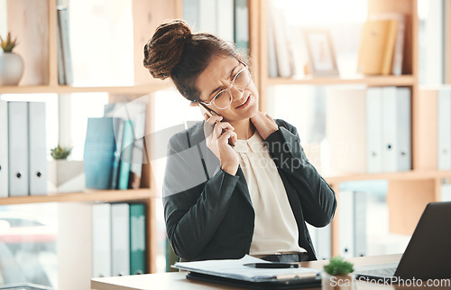 Image of Phone call, office and business woman with neck pain, injury or accident on a telehealth consultation. Corporate, professional and female employee with a back muscle sprain working in the workplace.