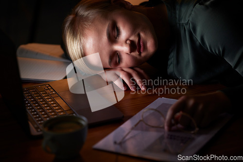 Image of Night, sleeping and tired woman at desk and laptop while planning, working on report and business research. Professional person, employee or worker with fatigue, low energy or time management problem