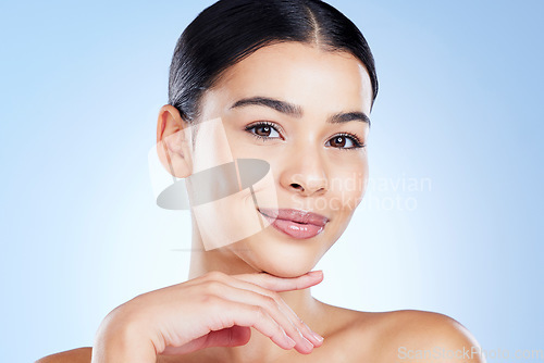 Image of Portrait, aesthetic and skincare with a model black woman in studio on a blue background for natural treatment. Face, beauty and spa with an attractive young female posing to promote cosmetics