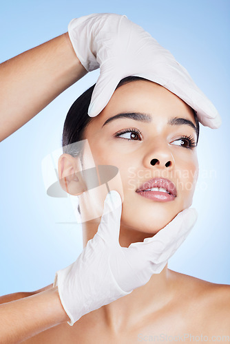 Image of Plastic surgery, face and surgeon hands for beauty, filler and change for a woman in studio. Aesthetic model person and doctor for cosmetic surgery, transformation or dermatology gradient background