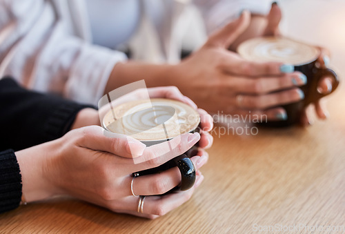 Image of Coffee, morning and hands of people with cups at a cafe for bonding, breakfast and conversation. Restaurant, relax and friends drinking a latte, warm beverage or drink from a mug at a diner together